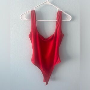 Brand new silky bodysuit. It didn’t fit me. My torso is too long 😅